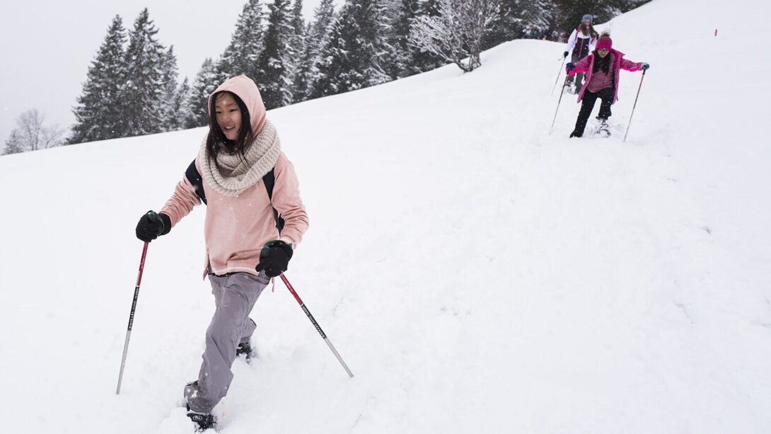 girl snowshoe hiking