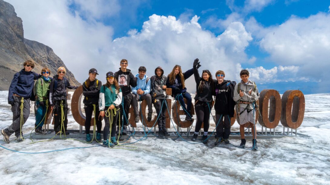 Students in the top of a glacier peak