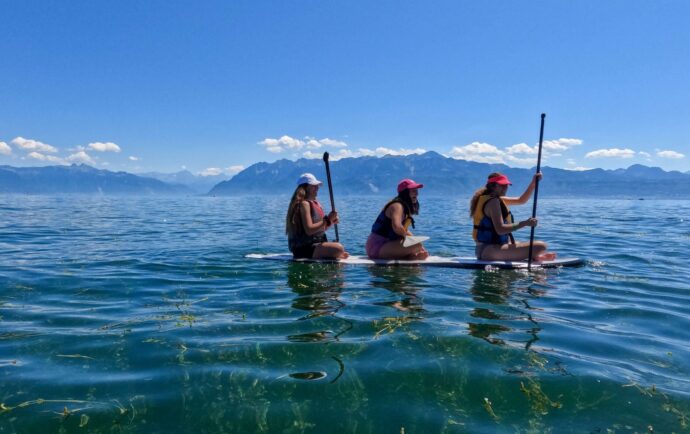 Girls paddling together in the lake